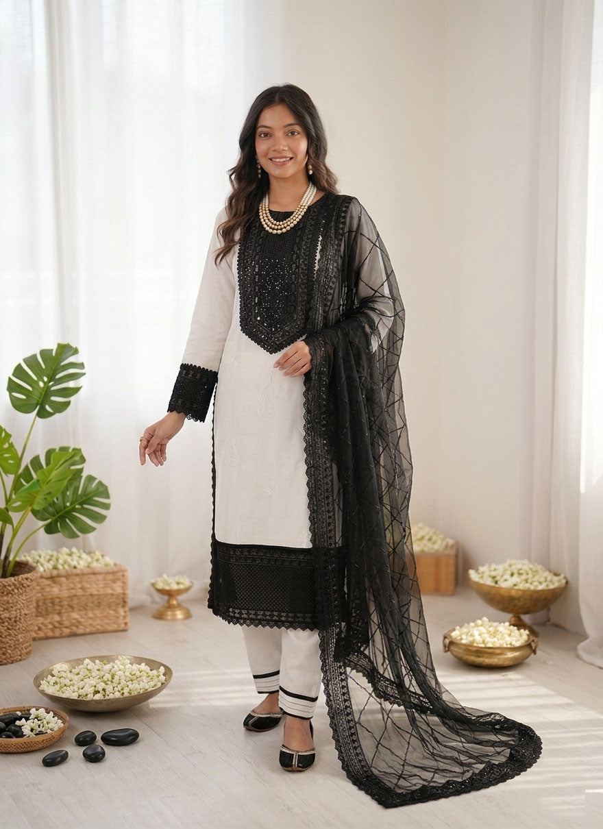 Off-white crepe salwar suit featuring intricate thread and sequence embroidery.