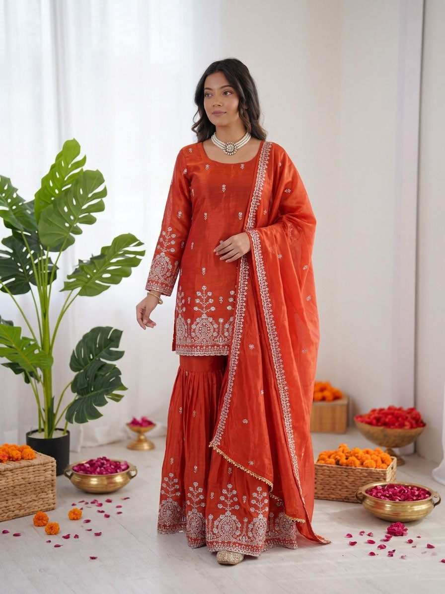 Rust orange art silk sharara suit adorned with sequence and thread work