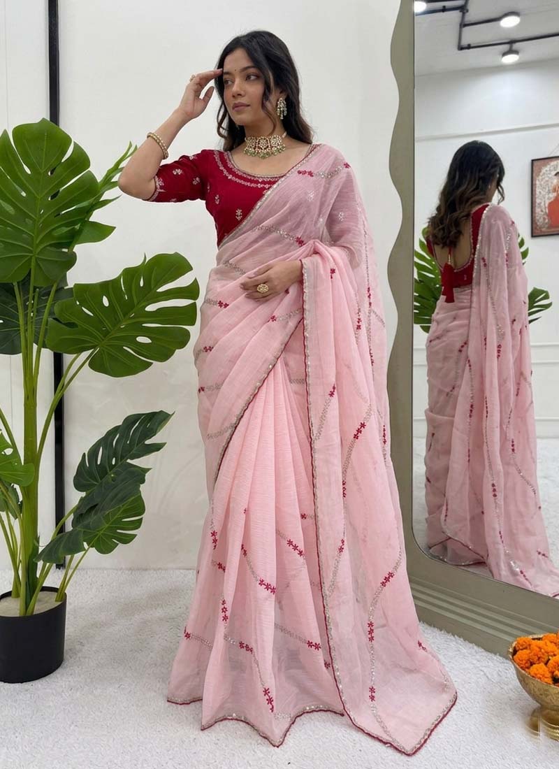 Little girl wearing a baby pink crunchy silk ready-to-wear party saree with thread sequence detail