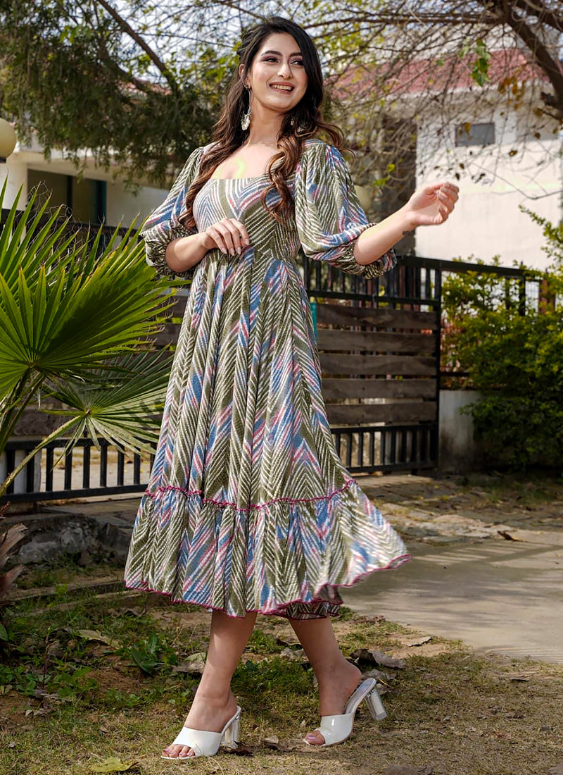 Woman wearing a vibrant multi-color rayon digital print western gown for festive occasions