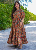 Woman wearing a vibrant multi-color rayon digital print western gown for festive occasions