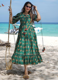 A stunning green rayon designer gown featuring vibrant digital prints, ideal for festive events and weddings.