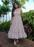 Off white designer gown featuring vibrant digital prints and fluid rayon fabric for festive events.