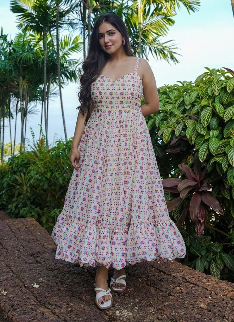 Off white designer gown featuring vibrant digital prints and fluid rayon fabric for festive events.