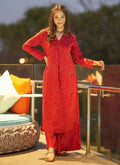 Woman wearing a vibrant red digital print designer kurti and matching pants for a festive occasion