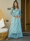 Electric blue muslin kurti pant set with digital prints, styled for festive or formal events.