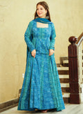Woman wearing a Rama green georgette designer gown with intricate digital prints for festive occasions.