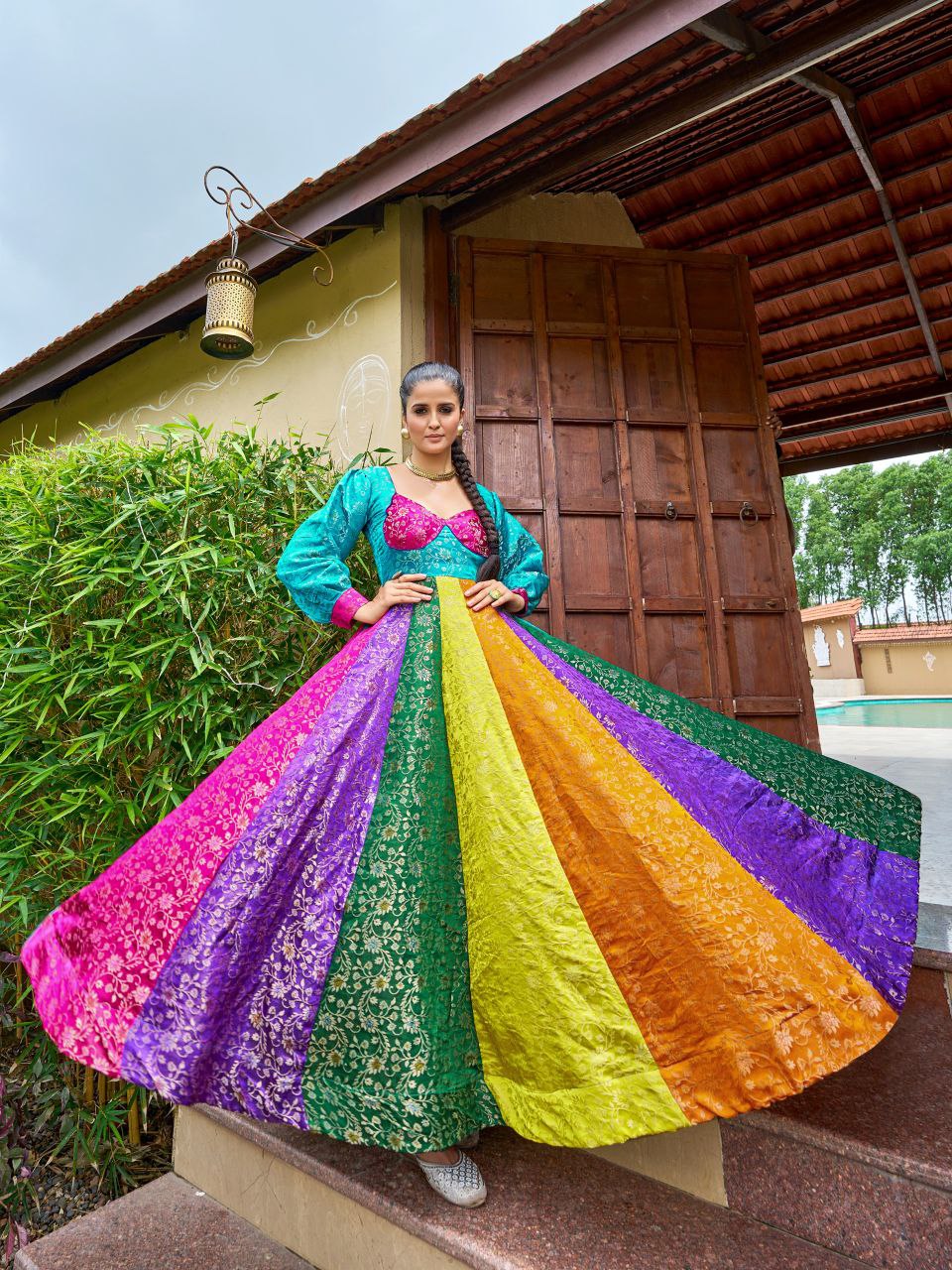 Multi-colored viscose gown with gold-toned intricate weaving for a festive look.