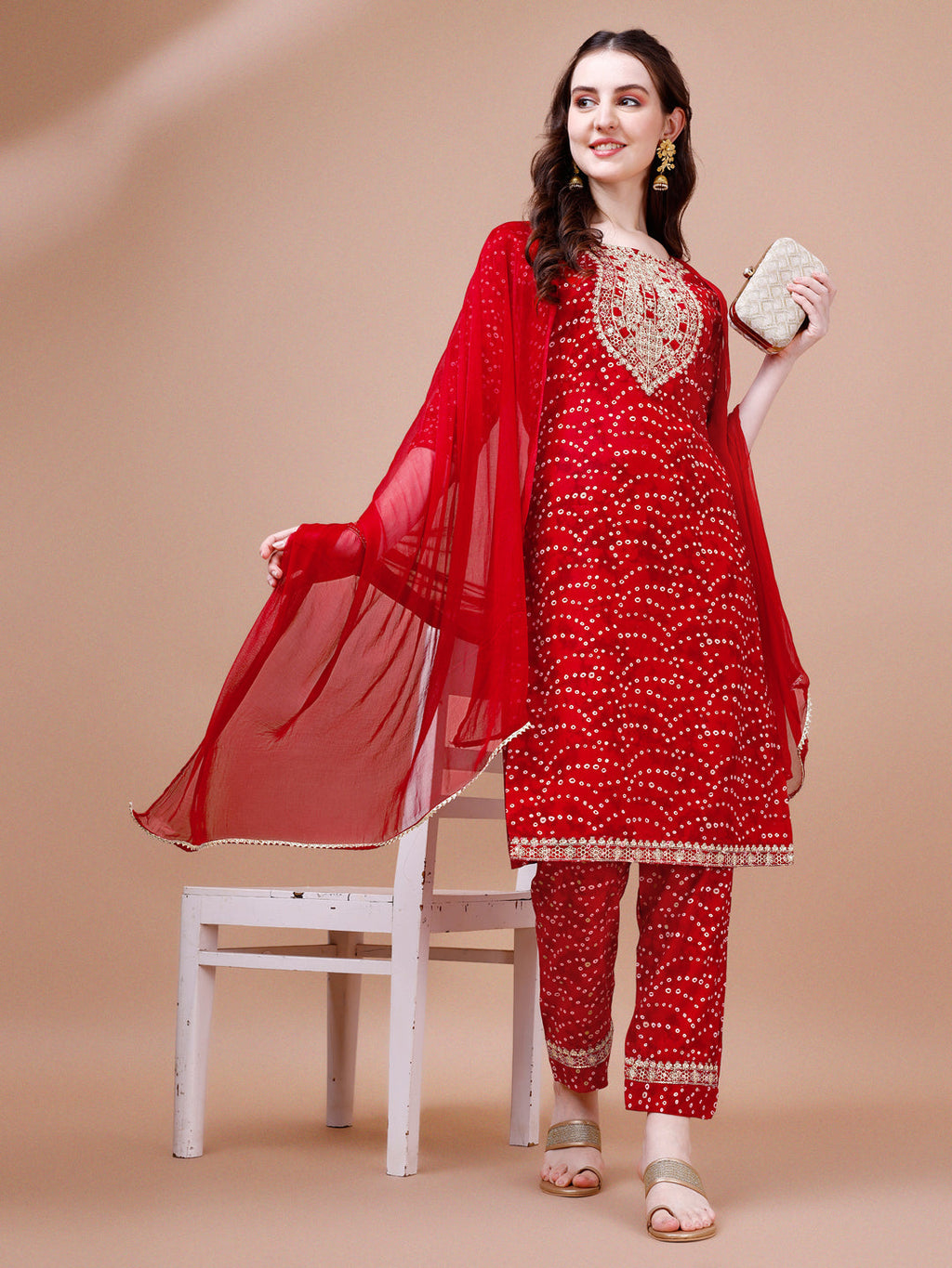 A multicolor Bandhani printed kurta set featuring elegant embroidery, complete with matching pants and dupatta.