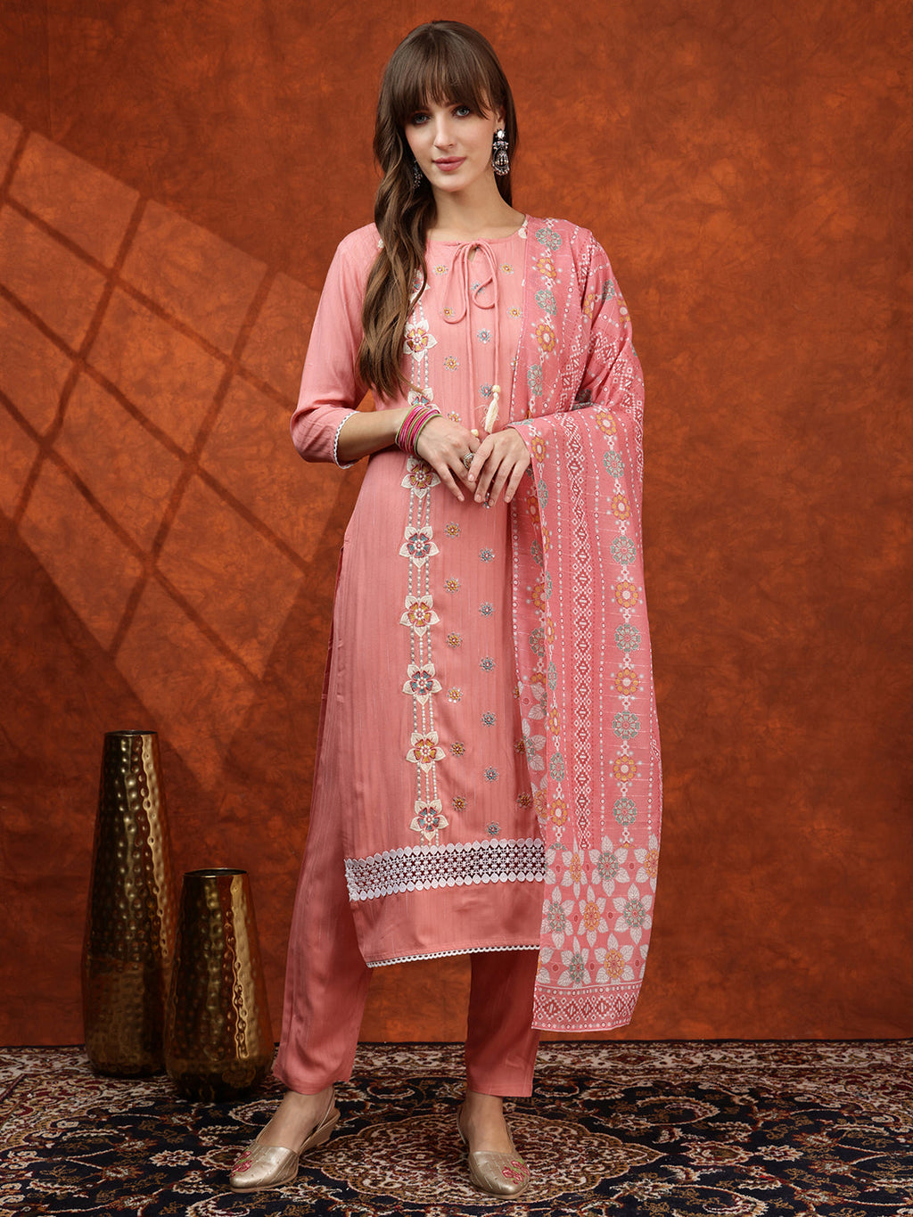 Pink floral embroidered kurta set with tie-up neck, pants, and matching dupatta