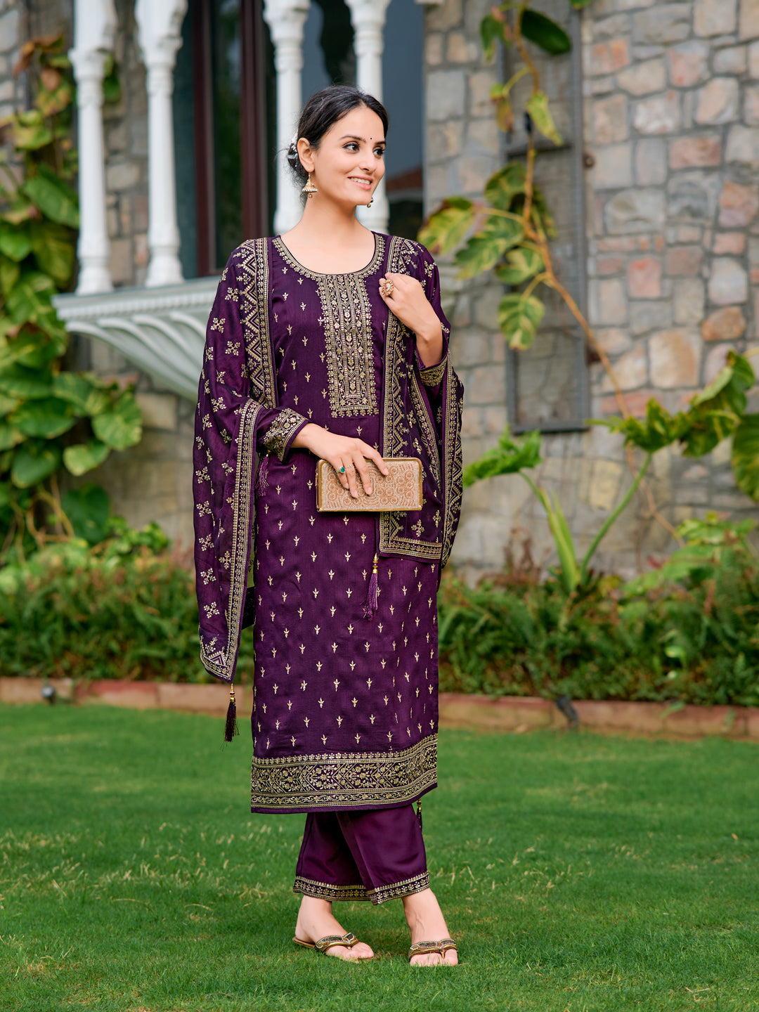Purple silk embroidered kurta paired with matching pant and dupatta