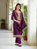 Model wearing a wine-colored embroidered silk-blend kurta set with 3/4 sleeves
