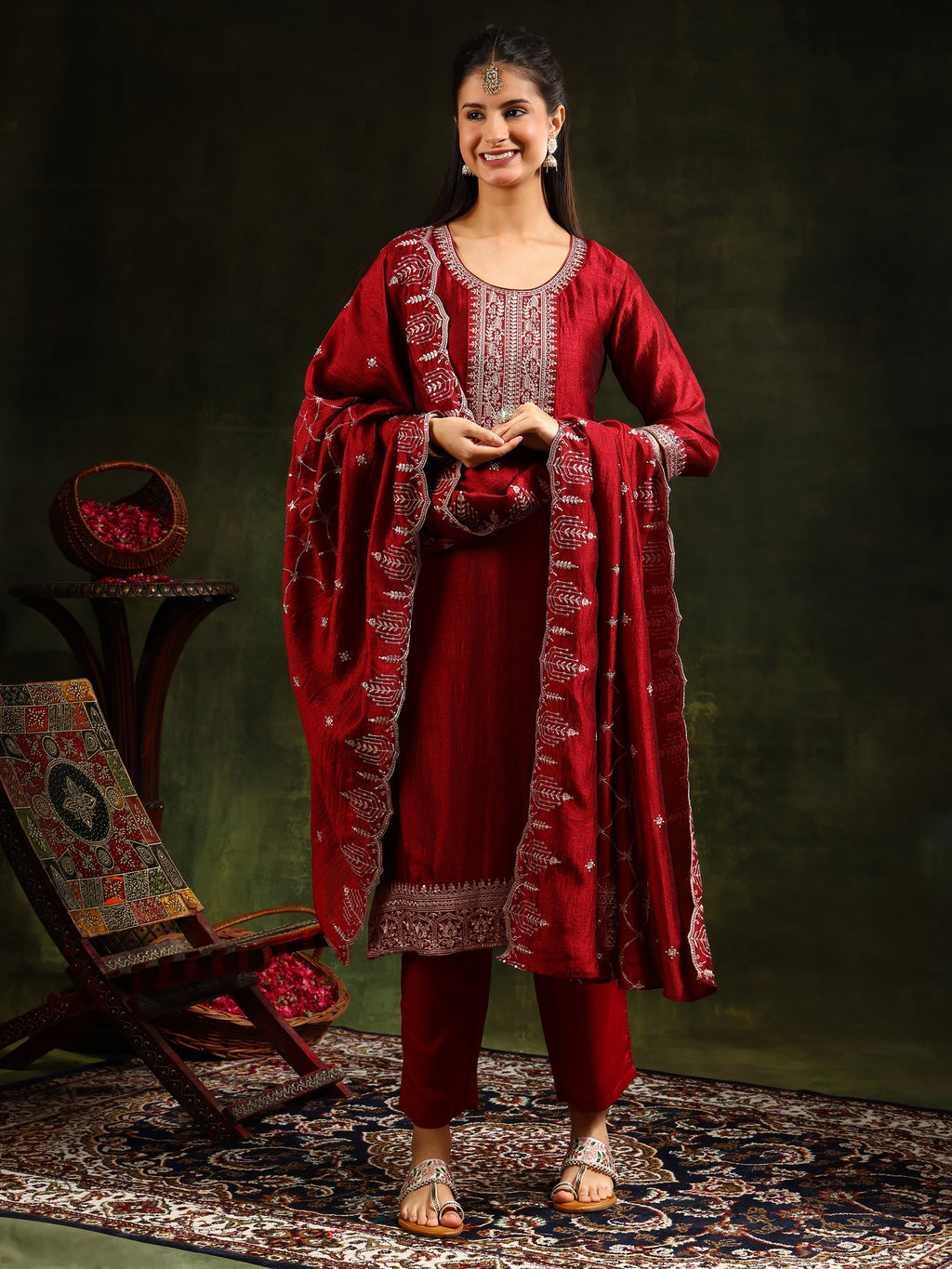 Maroon silk kurta set featuring intricate sequin embroidery with matching dupatta