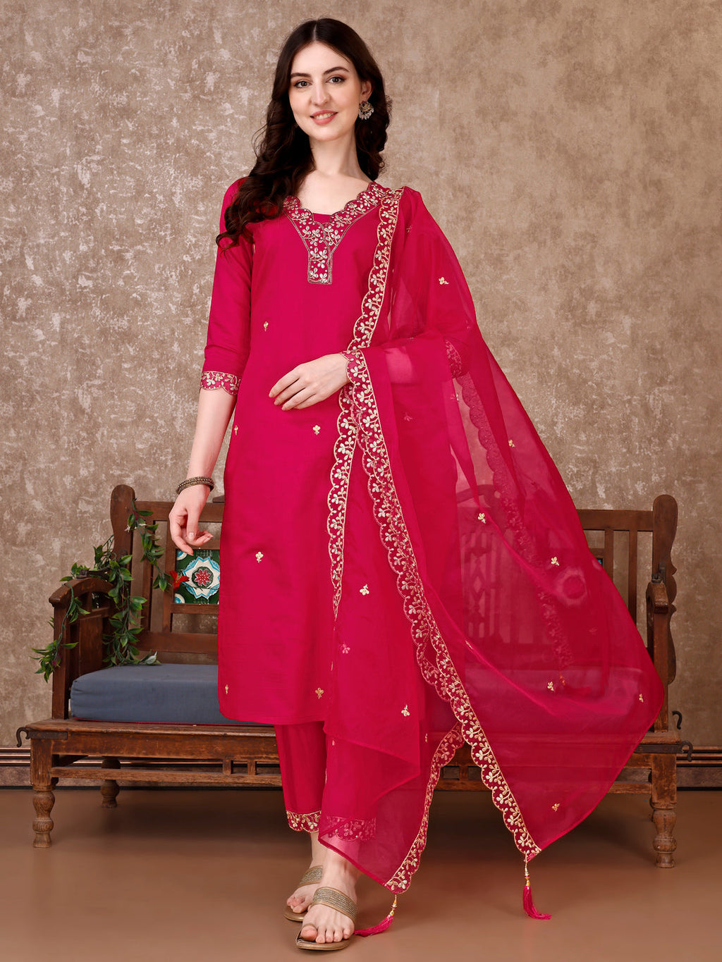 Pink embroidered Chanderi kurta set with matching pants and dupatta worn by a model
