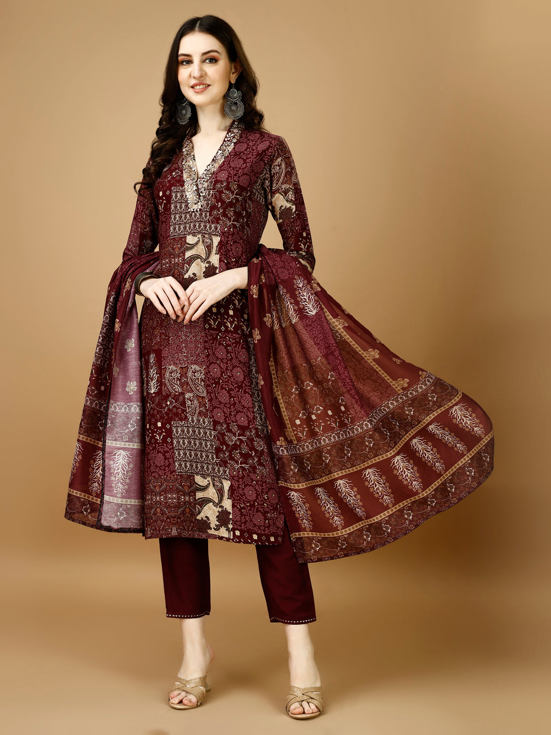 Multicolor printed kurta set with hand embroidery, featuring matching pant and dupatta