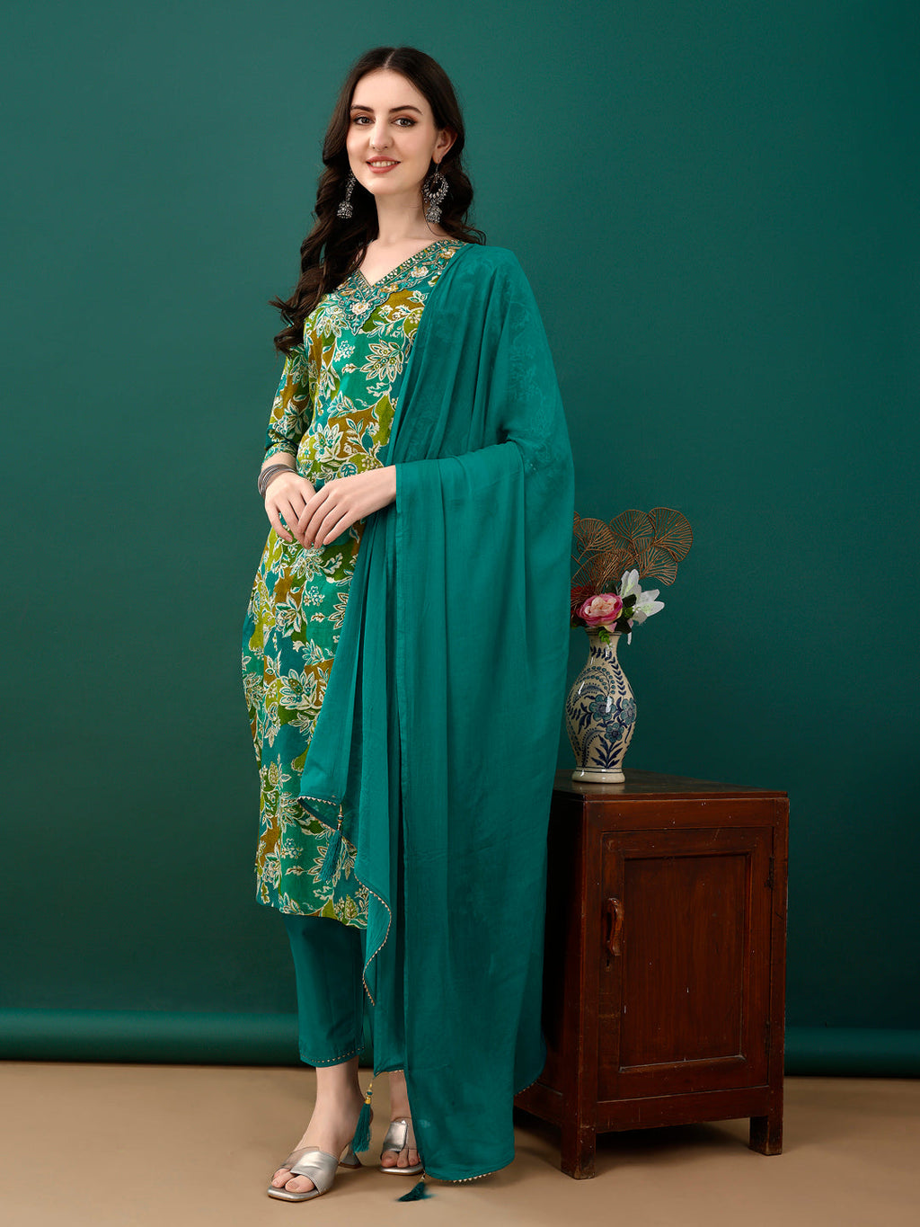 Teal cotton kurta featuring embroidery and floral print with matching pants and dupatta.