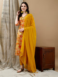 A vibrant yellow cotton kurta set featuring floral prints and embroidery with matching pants and dupatta.