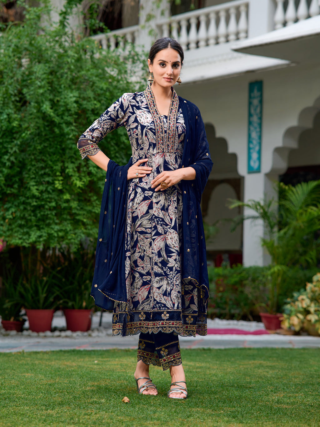 Navy blue Anarkali kurta with botanical prints, embroidery, pants, and matching dupatta