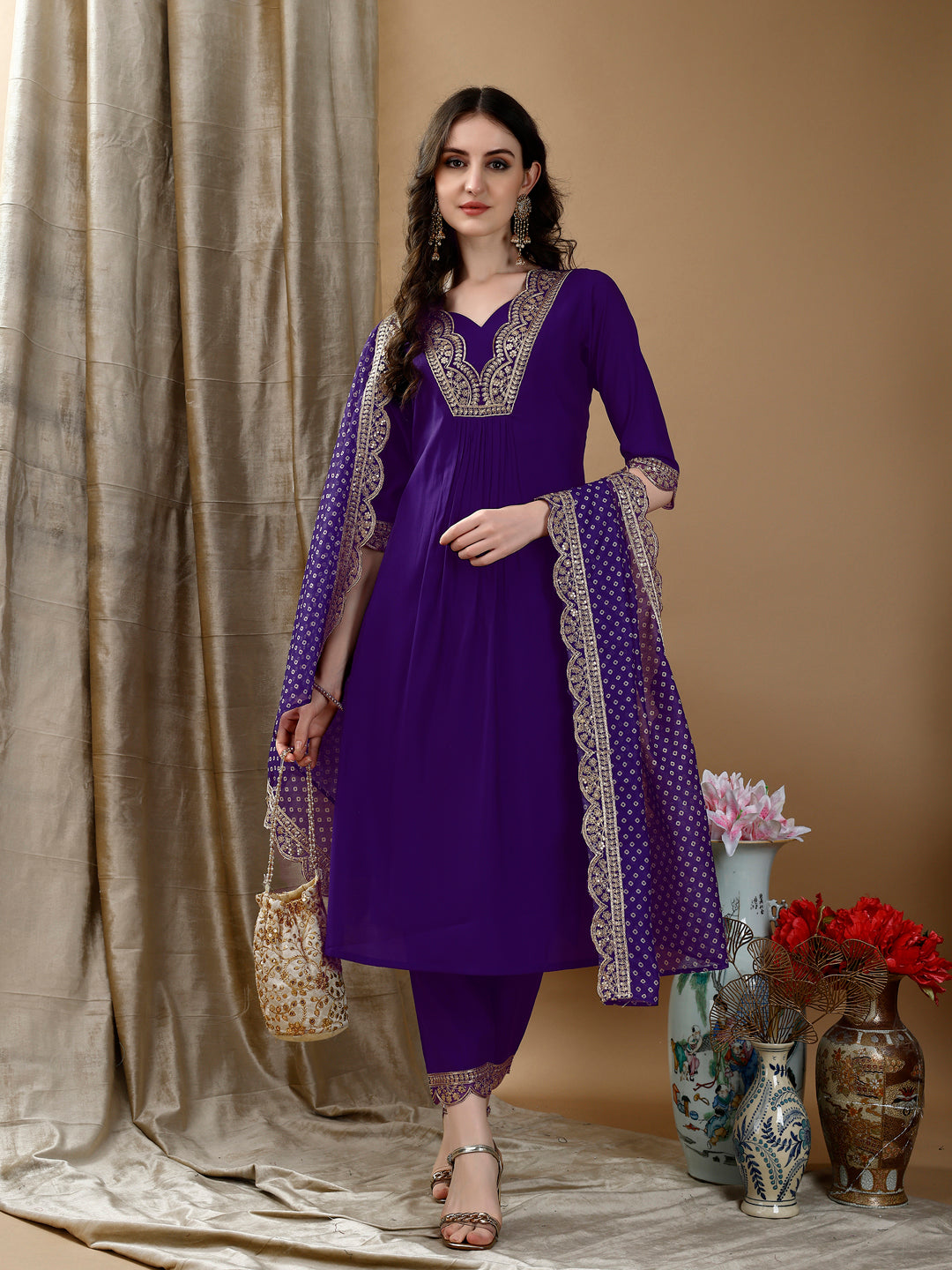 Royal purple embroidered chanderi kurta set with a traditional Bandhani printed dupatta.