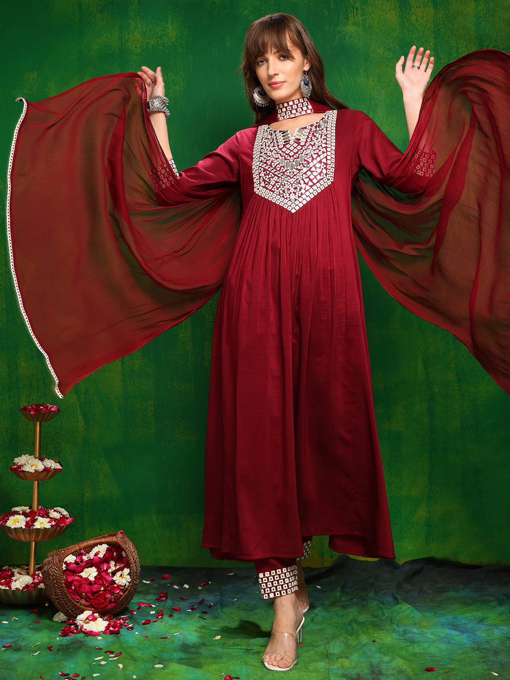 Woman wearing a maroon rayon kurta set featuring mirror embroidery and a necklace dupatta