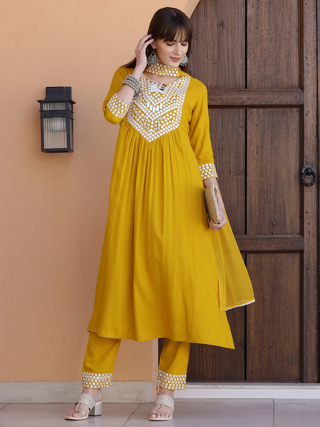 Mustard Hiral Fashion kurta set featuring mirror embroidery and a unique necklace dupatta.
