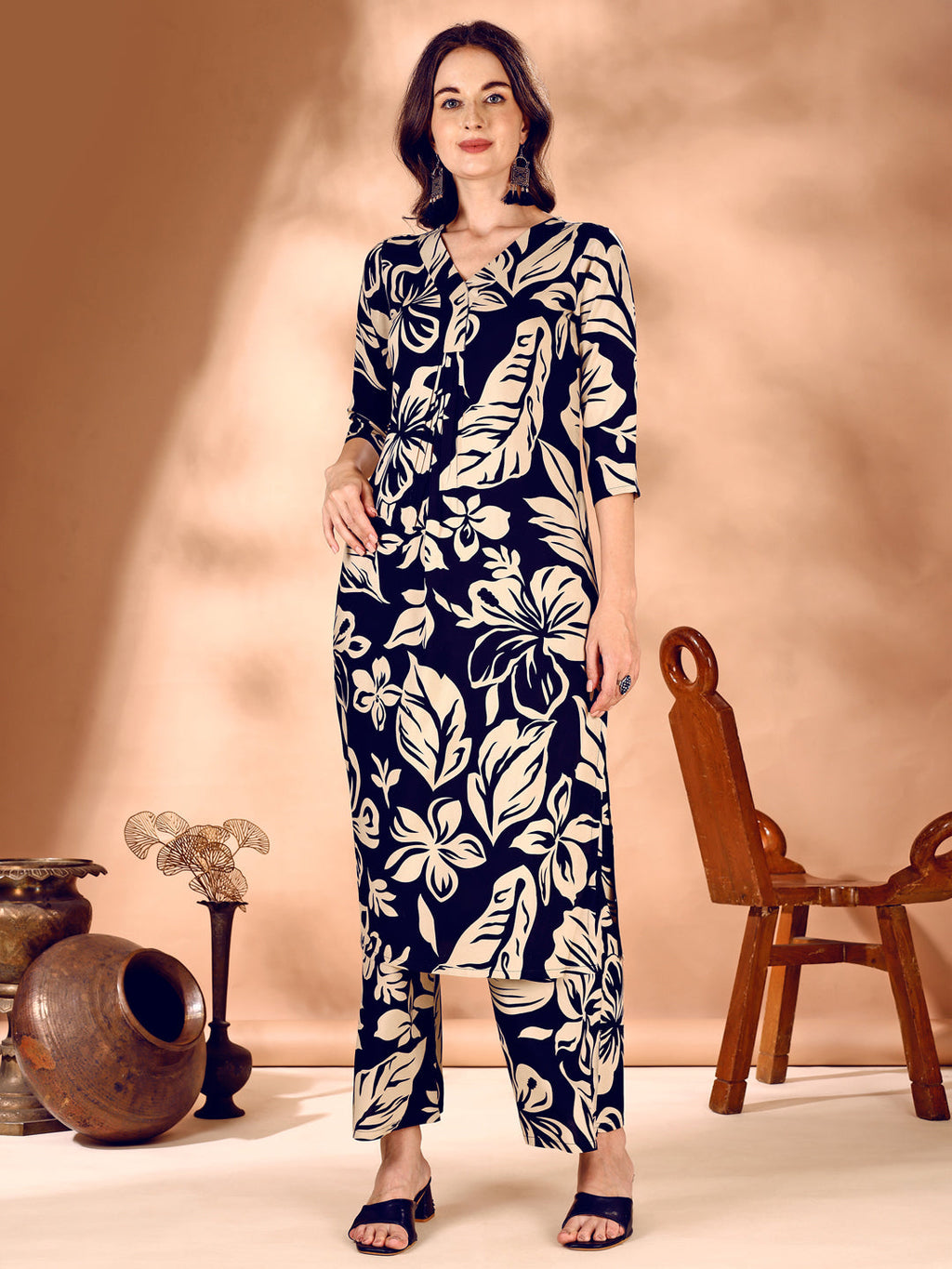 Woman wearing a Navy Blue Botanical Printed Rayon co-ord set with 3/4th sleeves.