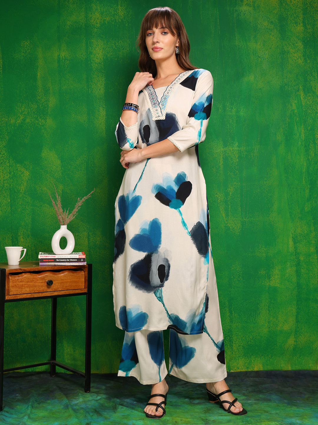 White rayon kurta with lace neck detailing paired with palazzo pants