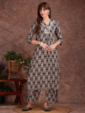 Black rayon kurta with ethnic motif print, lace detailing, and matching palazzo pants.