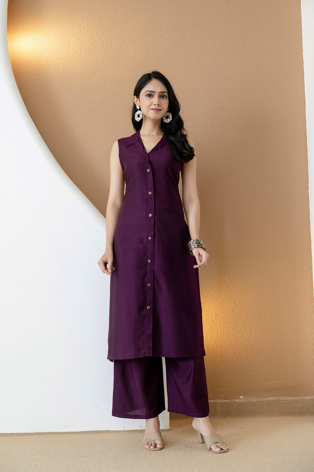 Model wearing a purple silk-blend shirt style kurta with matching palazzo pants