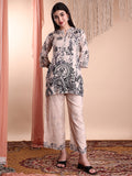 Woman wearing a beige floral and paisley printed rayon tunic and matching palazzo pants co-ord set.
