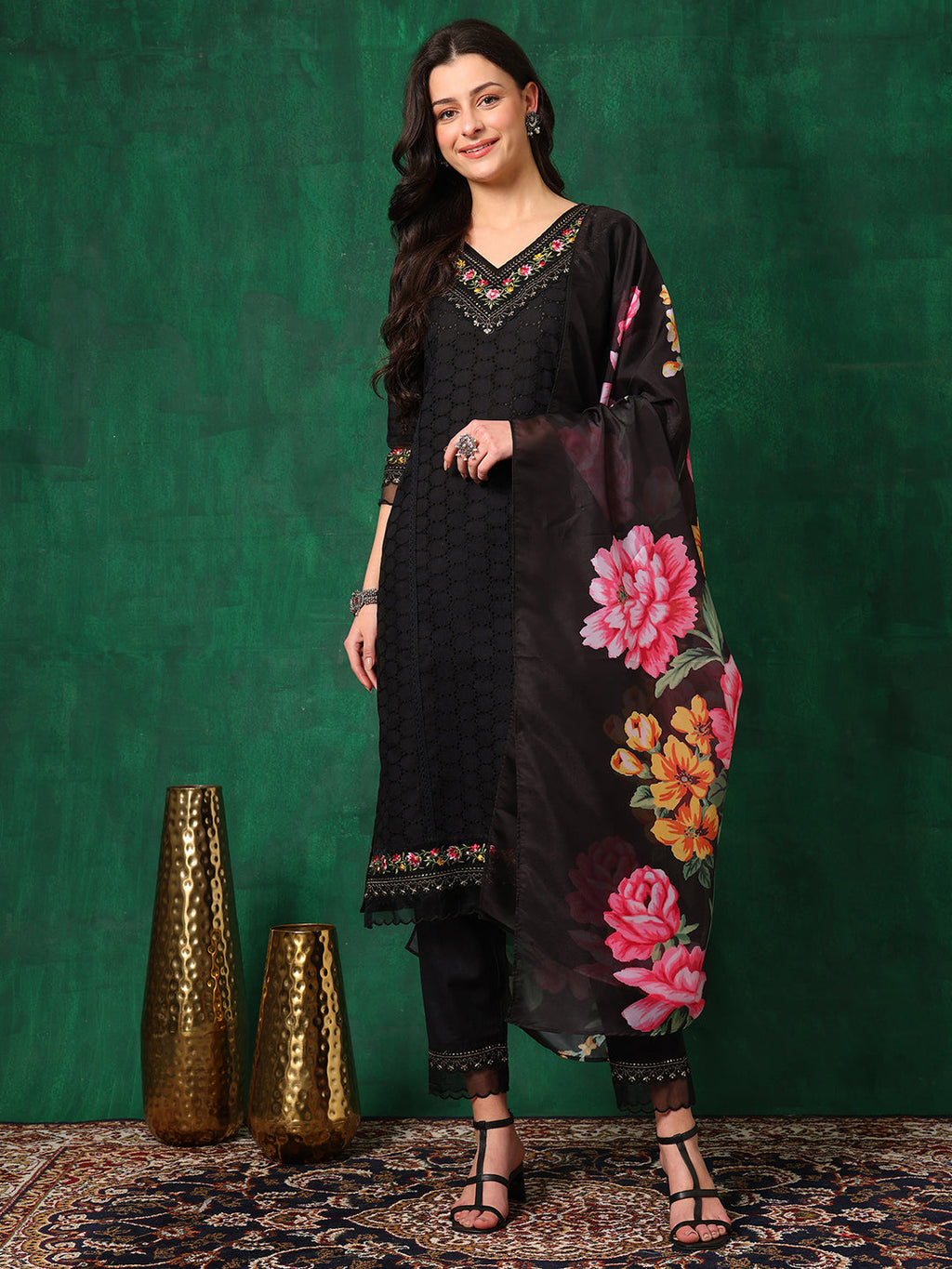 Model wearing a black Chikankari kurta with matching pants and a printed dupatta