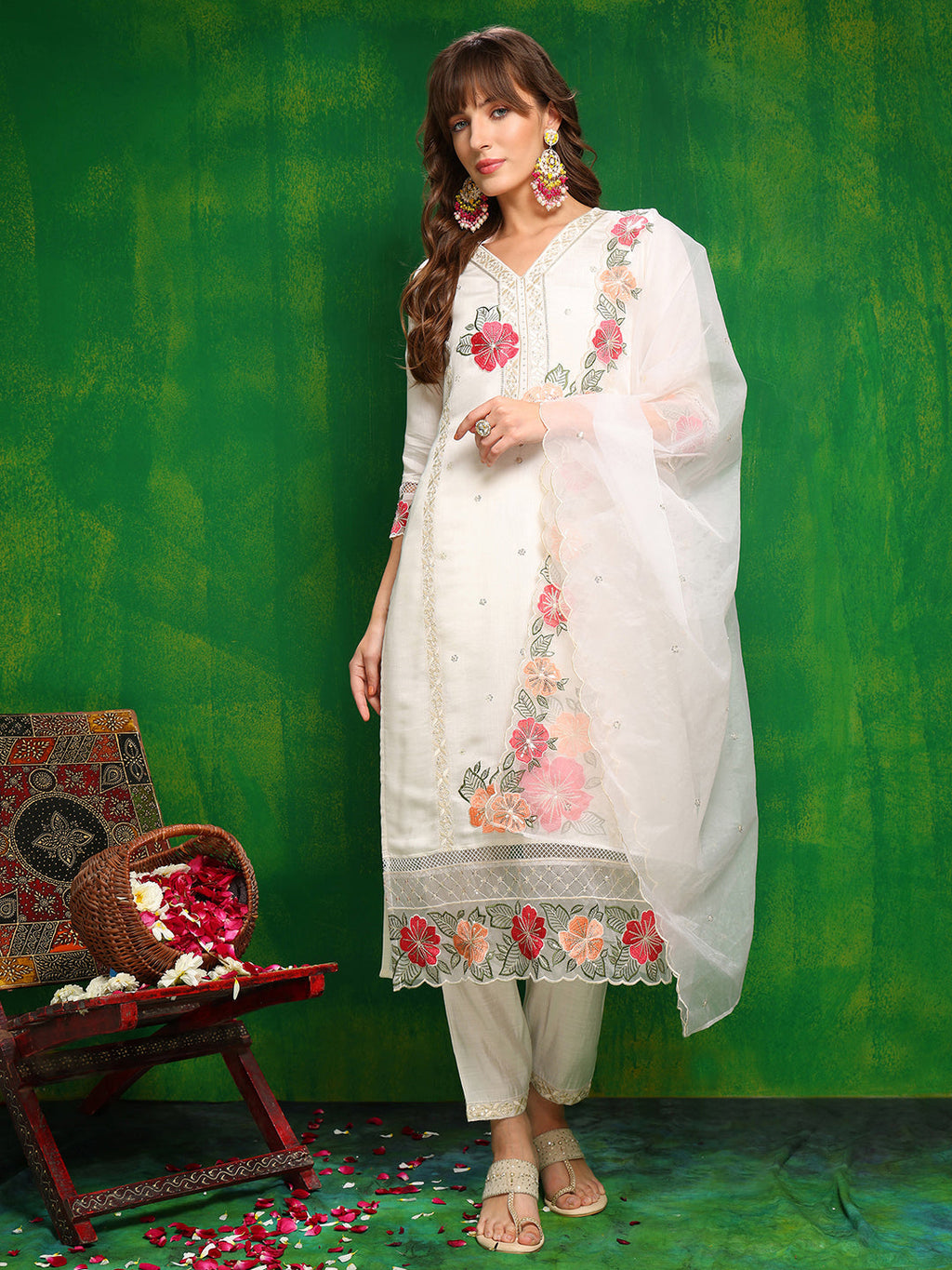 Woman wearing a white Chanderi kurta set with sequin embroidery and matching dupatta