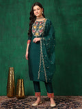 A stunning Bottle-Green embroidered silk-blend kurta paired with matching pants and a decorative dupatta.