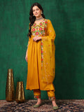 Woman wearing a mustard A-line silk-blend embroidered kurta set with matching pants and dupatta