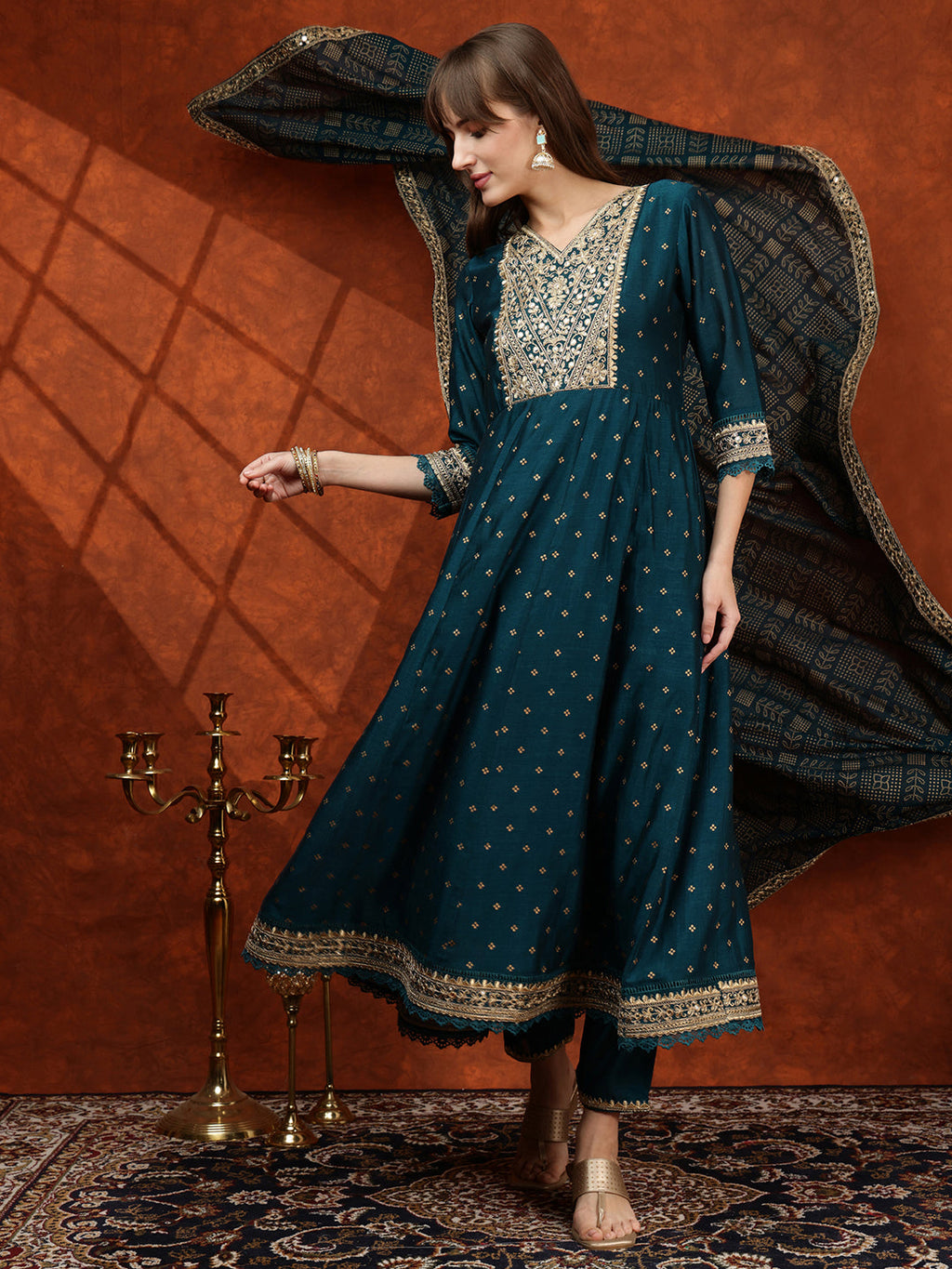 Teal Anarkali kurta with floral embroidery paired with a Bandhni dupatta and pant set