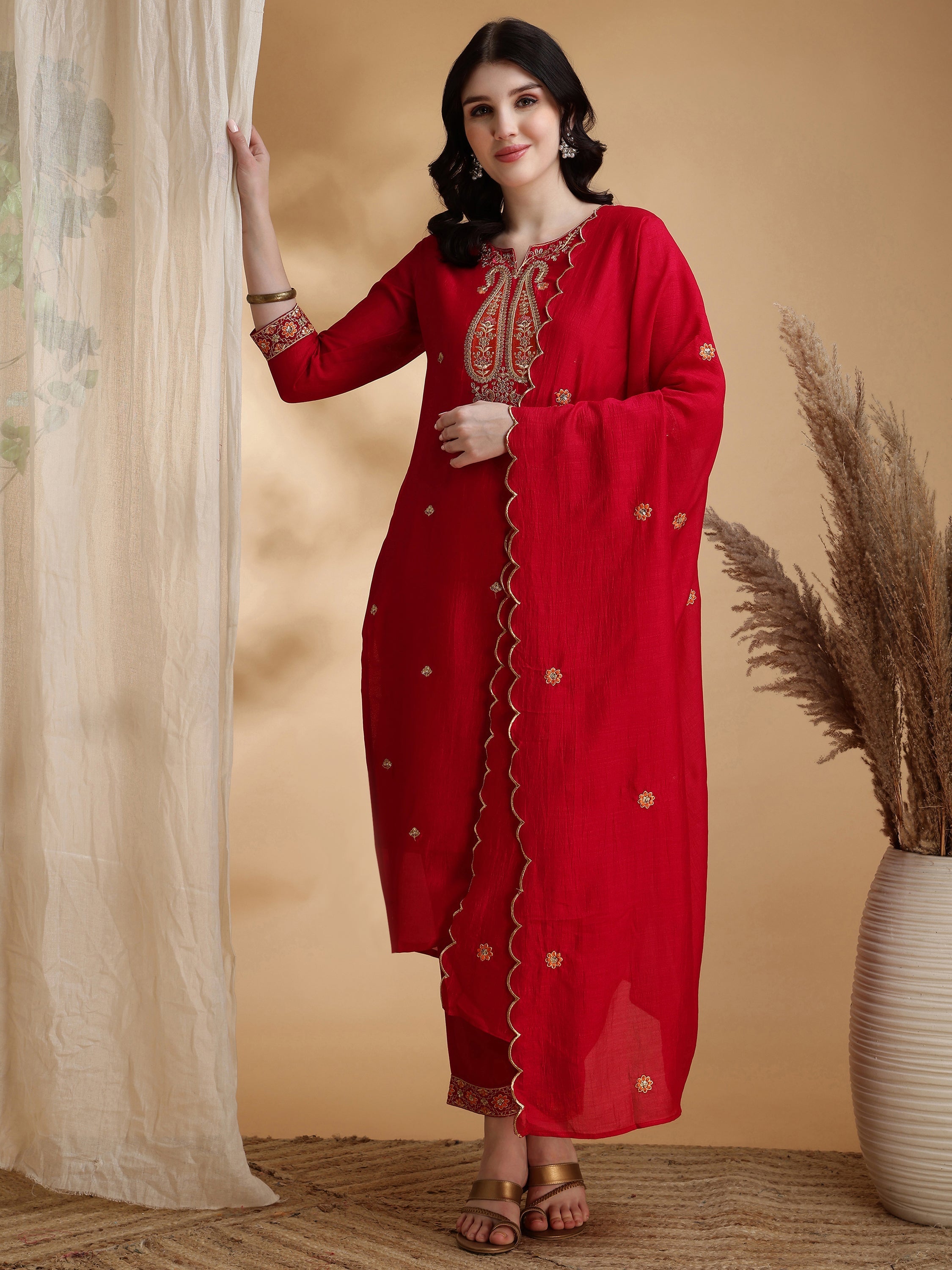 Pink silk kurta set with detailed embroidery and matching dupatta
