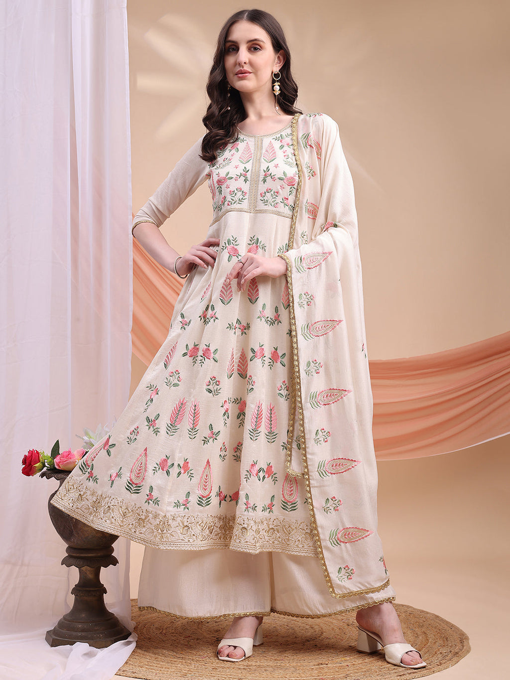Cream Anarkali kurta featuring floral embroidery with matching palazzo and dupatta