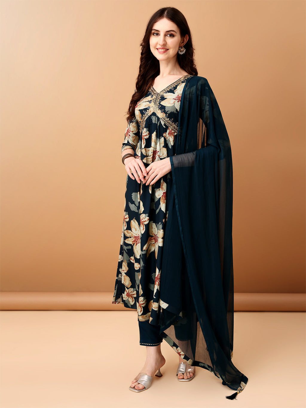 Woman wearing a teal Alia cut floral printed kurta with matching pants and dupatta