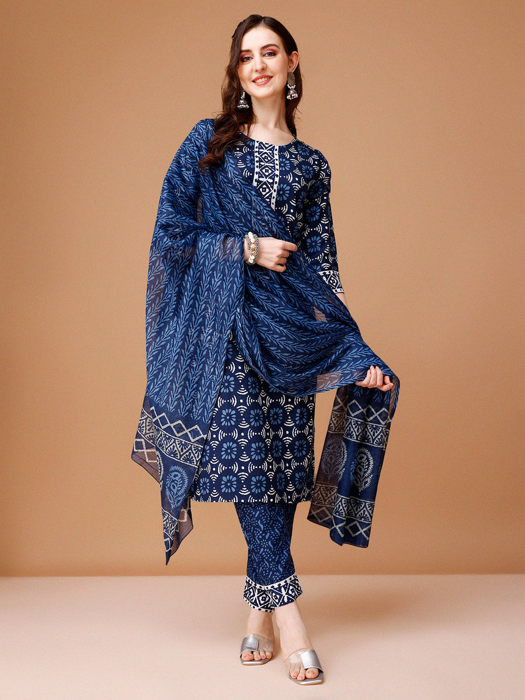 Woman wearing a multicolor printed rayon kurta set with coordinated pants and dupatta