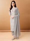 Woman wearing a grey Bandhani printed cotton kurta set with matching pants and dupatta.