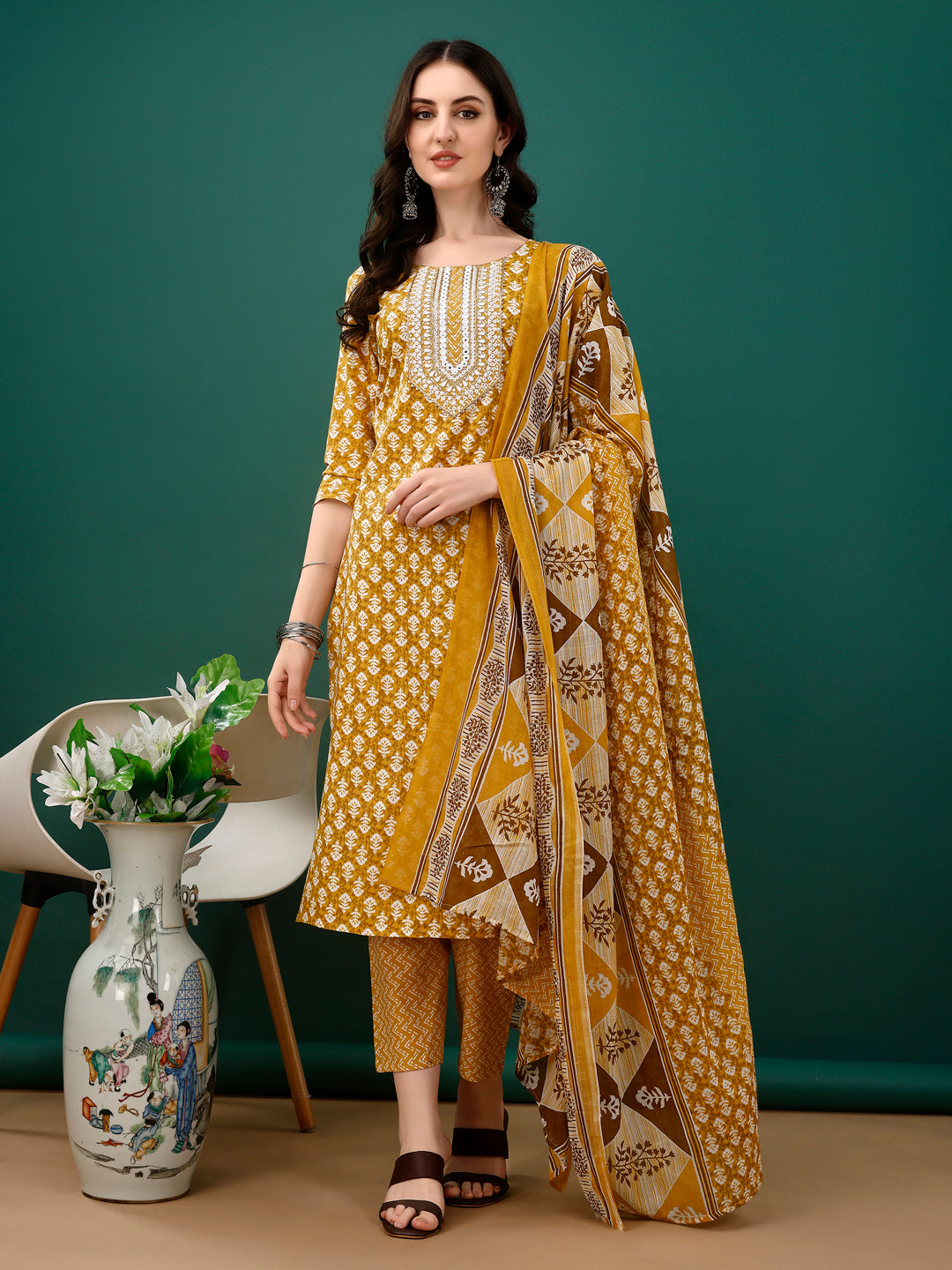 Mustard cotton embroidered kurta paired with matching pant and dupatta