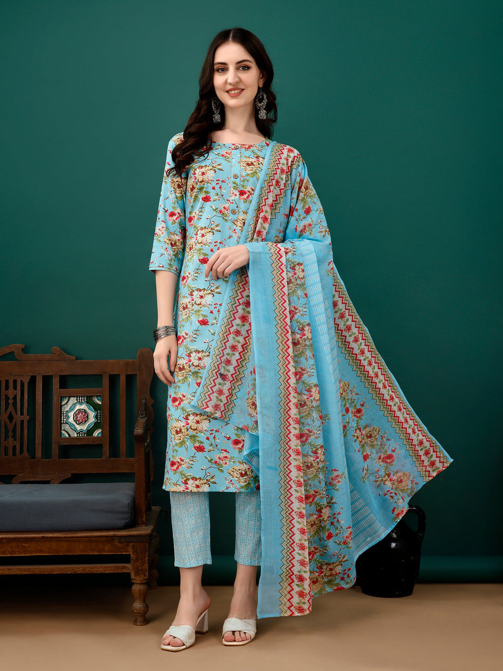 Beautiful blue floral printed cotton kurta with 3/4th sleeves, matching pants, and dupatta.