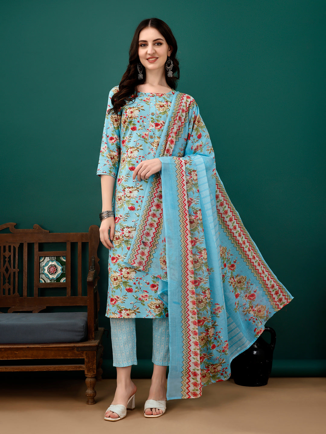 Beautiful blue floral printed cotton kurta with 3/4th sleeves, matching pants, and dupatta.