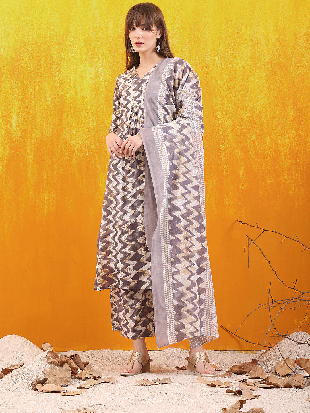 Grey chevron printed kurta paired with palazzo pants and a matching dupatta