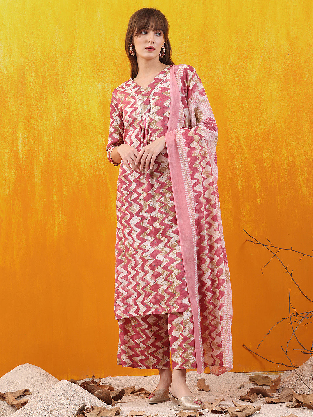 Pink chevron printed kurta with palazzo pants and dupatta.
