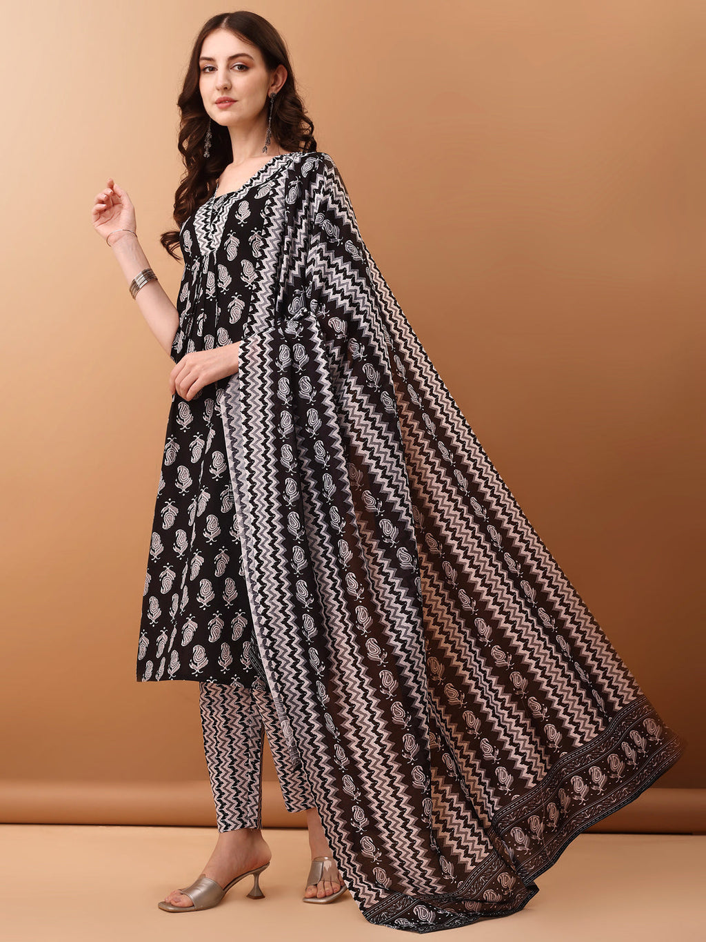 Black floral printed cotton kurta set with 3/4th sleeves, matching pants, and dupatta.