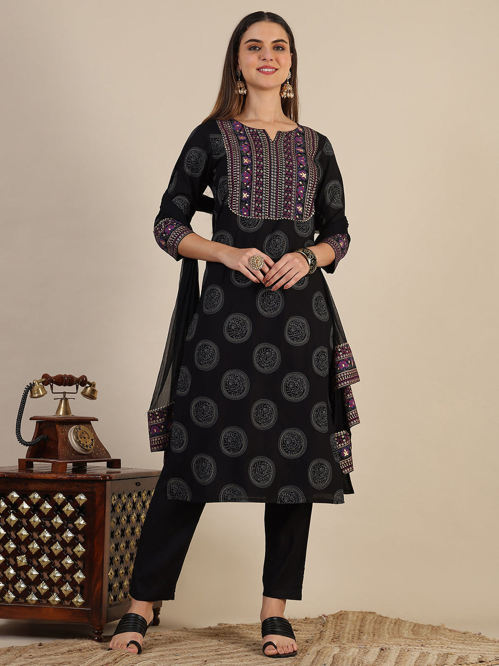 Black printed rayon kurta set with 3/4th sleeves, matching pants, and printed dupatta.