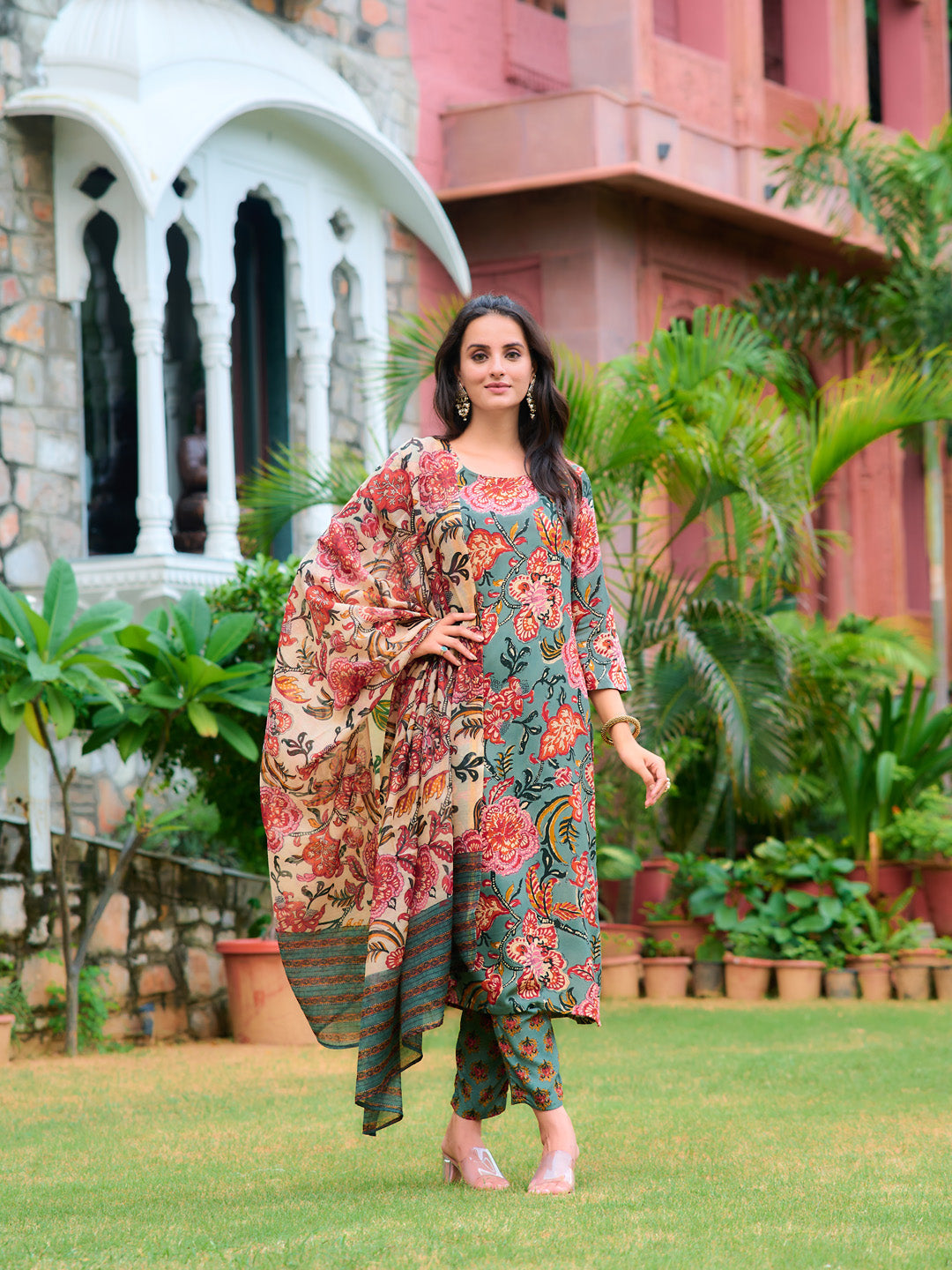Woman wearing a green printed rayon kurta set with matching dupatta and pant