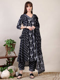 Woman wearing a black printed flared kurta set with matching Afghani pants and dupatta
