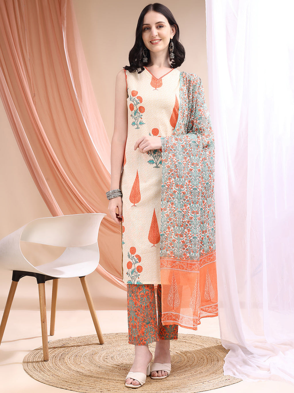 Orange kurta set featuring ethnic motif prints with matching pant and dupatta